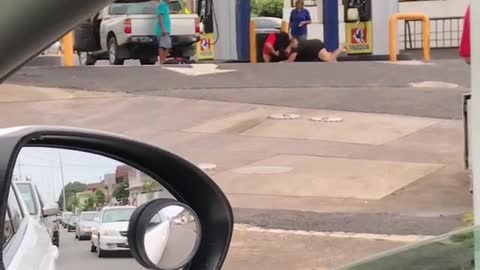 Two girls fighting at gas station