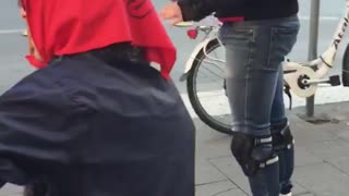 Group of men on skates on corner of street