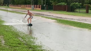 Dudes in Darwin Make the Most of Wet Weather