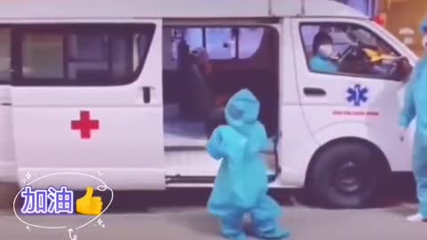 4 years old girl with hazmat suit being sent off to a Covid quarantine camp alone
