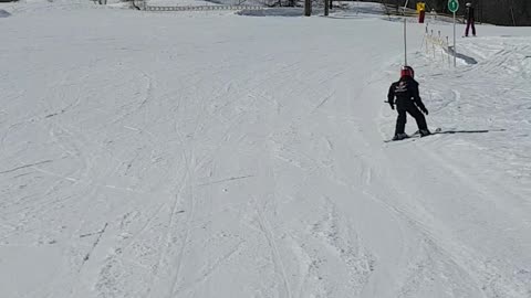 Fearless 5 year old skiing down the slopes