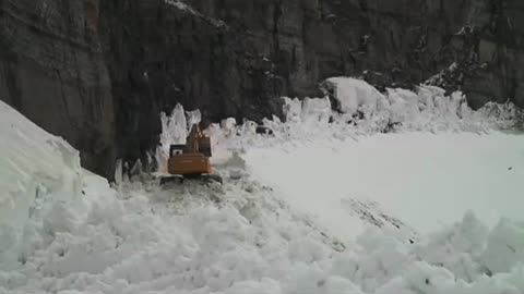 Plowing at Rimrock - Glacier National Park