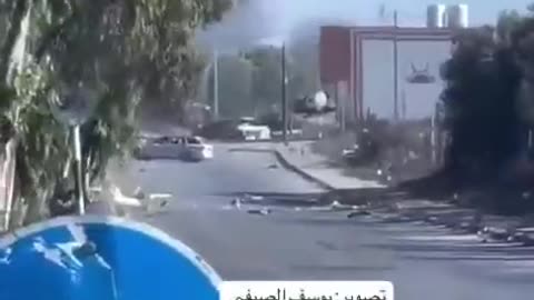 An Israeli tank fires at a civilian vehicle