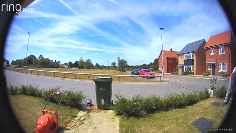 Man Takes a Tumble Over Lawnmower