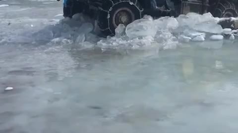 Truck in the ice mud water