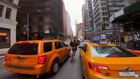 Bike Messenger Riding Fast and Fluid Through NYC Traffic