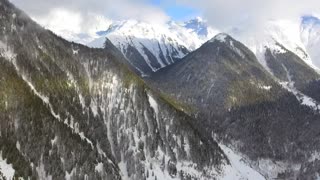 Flying over the snowy mountains and Winter Forest