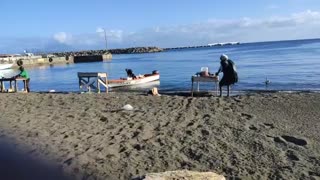 Fishermen cleaning fish St Kitts