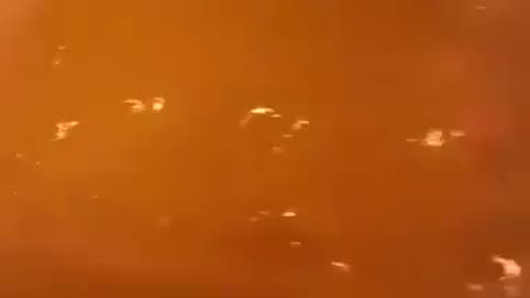 Chilean Fire Fighters Driving Through Flames.