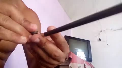 carving miniature keys on a graphite pencil