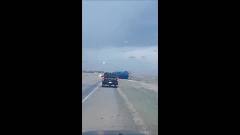 Heavy Winds Send Massive Grain Bin Rolling Across Highway