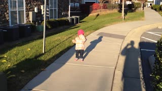 Little Girl Thinks She Is Stuck Behind A Sidewalk Crack