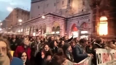 Genova Italy- Protesters singing they can stick their covid rules up their ass
