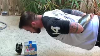 Amputee Does No-Arm Pushups for Donuts