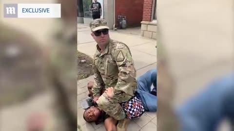 Man In Military Fatigues Flattens Man With Haymaker, Sits On His Chest