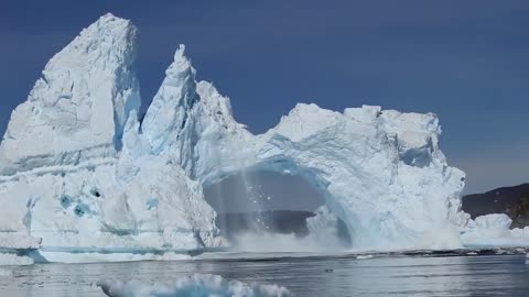 Iceberg crashing in Diskobay Greenland