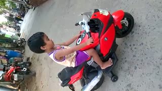 Baby girl riding BMW K 1300 bike