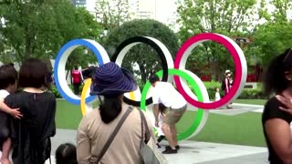 Medallists allowed maskless photo-op on podium