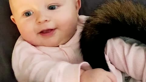 Adorable Baby Plays With Dog's Tail