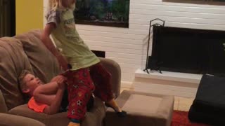 Little boy throws girl across living room